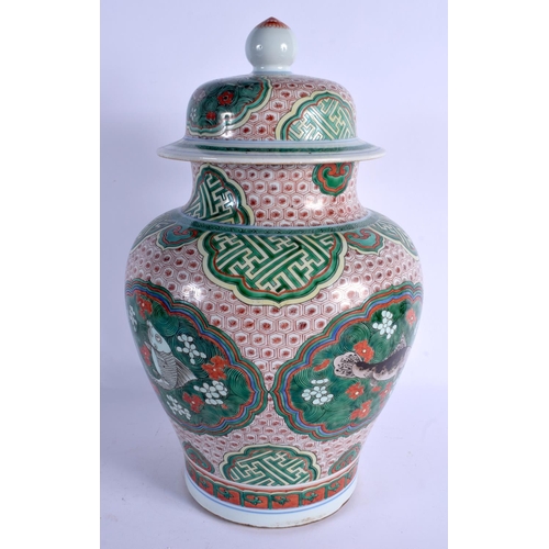 2148 - A LARGE 19TH CENTURY CHINESE WUCAI PORCELAIN VASE AND COVER Qing, enamelled with fish amongst foliag... 