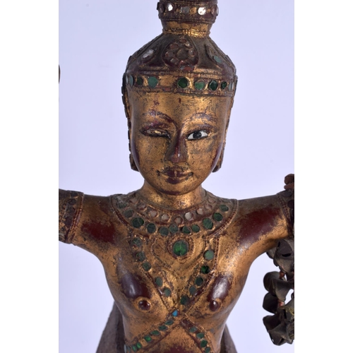 2150 - A SOUTH EAST ASIAN THAI GILTWOOD FIGURE OF A BUDDHISTIC DEITY modelled jewelled. 47 cm high.