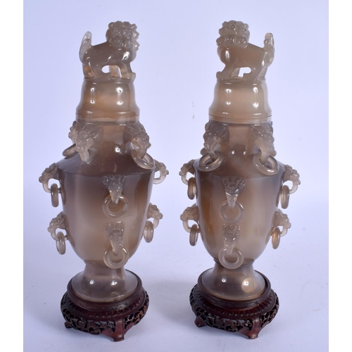 2164 - A PAIR OF EARLY 20TH CENTURY CHINESE CARVED AGATE VASES AND COVERS Late Qing/Republic, decorated wit... 