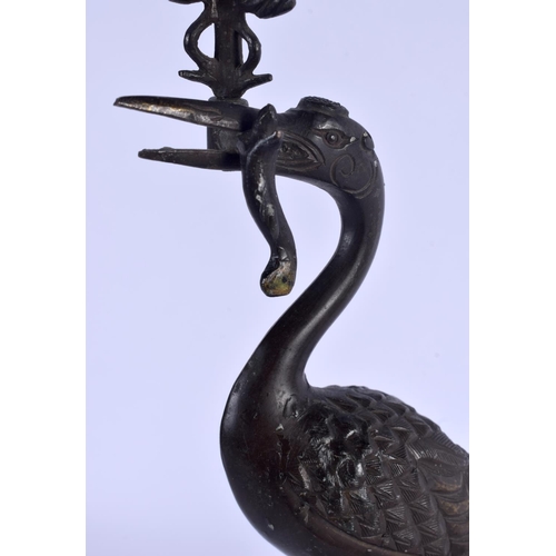 2167 - A PAIR OF 19TH CENTURY JAPANESE MEII PERIOD BRONZE CANDLESTICKS modelled as birds upon a beast. 21 c... 