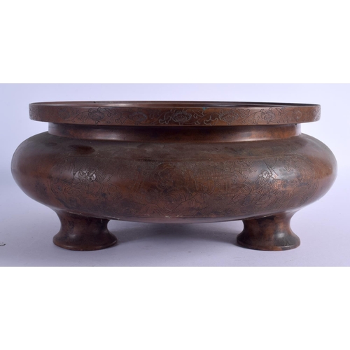 2168 - A LARGE CHINESE BRONZE CIRCULAR SQUAT CENSER 20th Century, decorated with figures within landscapes.... 