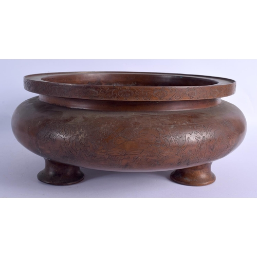 2168 - A LARGE CHINESE BRONZE CIRCULAR SQUAT CENSER 20th Century, decorated with figures within landscapes.... 