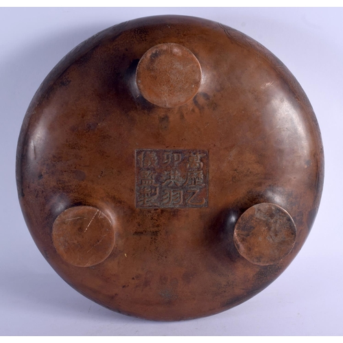 2168 - A LARGE CHINESE BRONZE CIRCULAR SQUAT CENSER 20th Century, decorated with figures within landscapes.... 