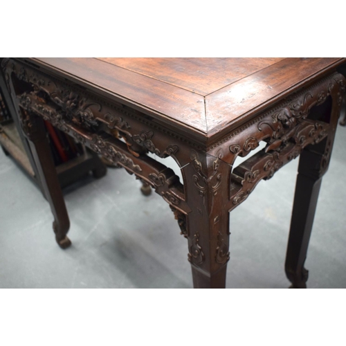 2171 - A FINE 19TH CENTURY CHINESE CARVED HONGMU HARDWOOD TABLE Qing, carved with mask heads and extensive ... 