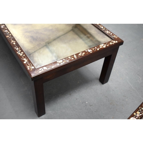 2174 - A NEAR PAIR OF 19TH CENTURY CHINESE MIRRORED HARDWOOD COFFEE TABLES decorated with foliage. 143 cm x... 