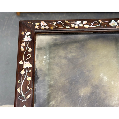 2174 - A NEAR PAIR OF 19TH CENTURY CHINESE MIRRORED HARDWOOD COFFEE TABLES decorated with foliage. 143 cm x... 