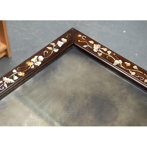 2174 - A NEAR PAIR OF 19TH CENTURY CHINESE MIRRORED HARDWOOD COFFEE TABLES decorated with foliage. 143 cm x... 