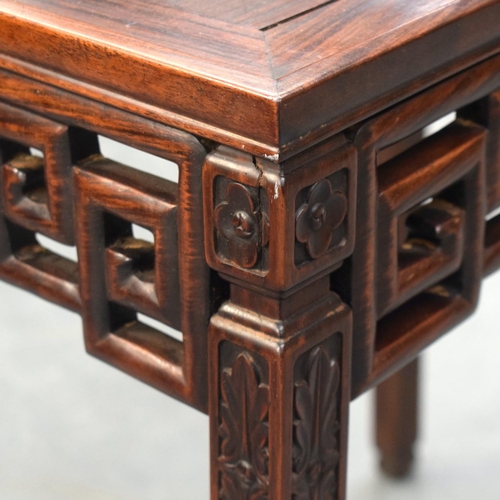 2175 - A STYLISH EARLY 20TH CENTURY CHINESE HARDWOOD HONGMU TABLE with foliate frieze and Greek key decorat... 