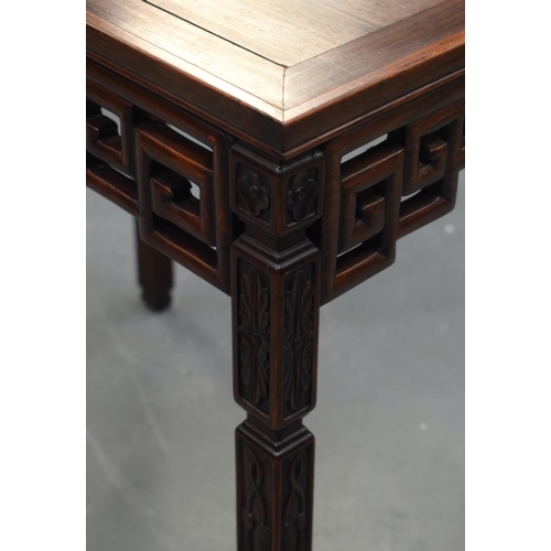 2175 - A STYLISH EARLY 20TH CENTURY CHINESE HARDWOOD HONGMU TABLE with foliate frieze and Greek key decorat... 