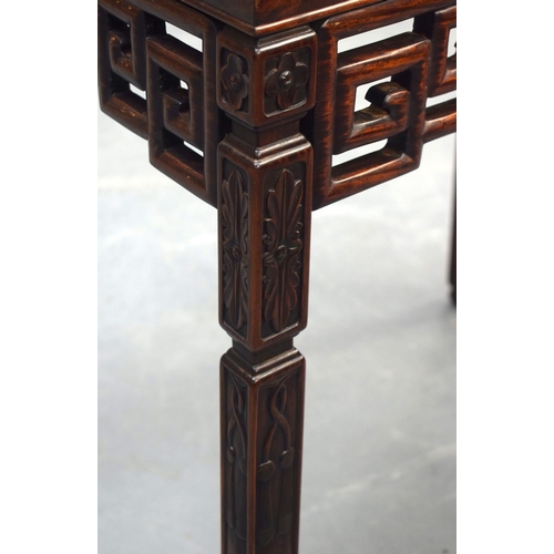 2175 - A STYLISH EARLY 20TH CENTURY CHINESE HARDWOOD HONGMU TABLE with foliate frieze and Greek key decorat... 