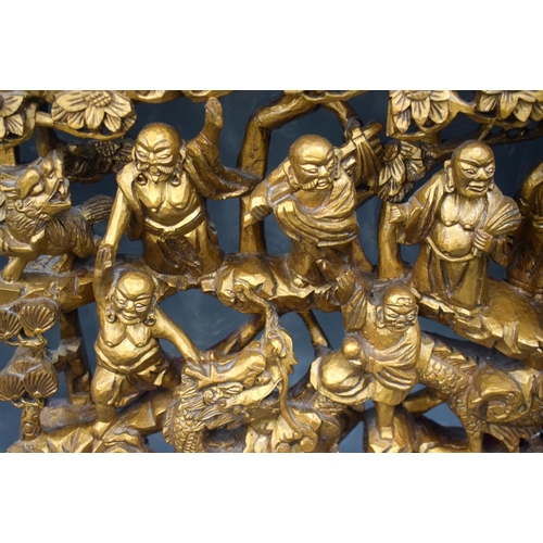 2179 - A LARGE 19TH CENTURY CHINESE CARVED WOOD TEMPLE PANEL Qing, depicting the eighteen luohans. Wood 62 ... 