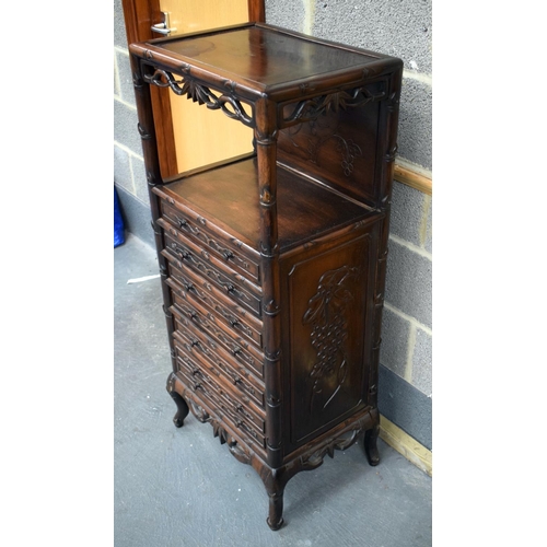 2182 - A RARE 19TH CENTURY CHINESE CARVED HONGMU HARDWOOD DISPLAY CABINET with six drawers and floral friez... 