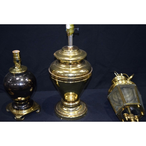 2561 - Collection of brass lamp bases, candle sticks and hanging lights largest 47cm. Qty.