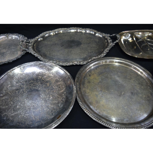 2562 - Collection of large silver plated serving salvers  Largest 74 x 17 cm (7).