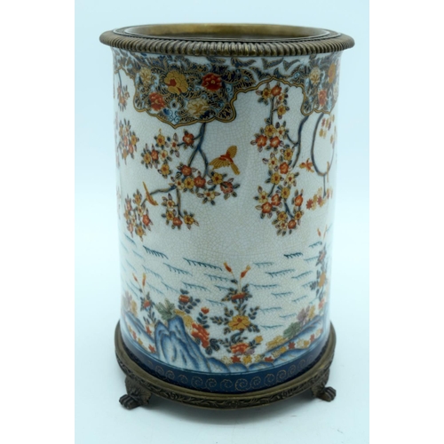 2569 - A large European glazed pot in a Chinese style decorated with foliage mounted on a bronze stand 29 x... 