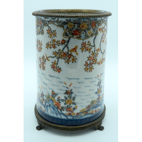 2569 - A large European glazed pot in a Chinese style decorated with foliage mounted on a bronze stand 29 x... 