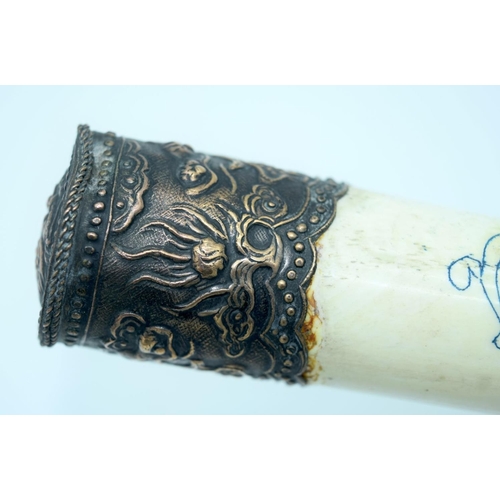 2570 - Chinese engraved bone opium pipe with a hardwood stand. 42cm.