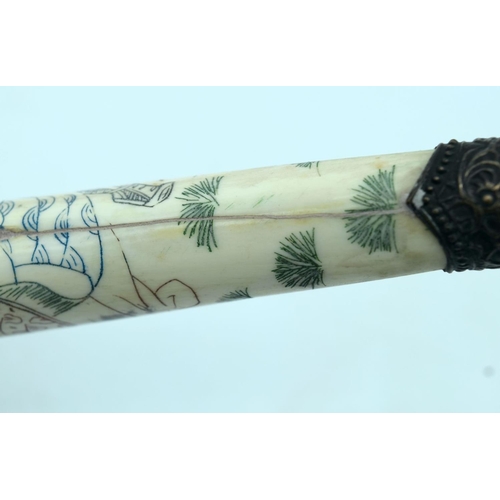 2570 - Chinese engraved bone opium pipe with a hardwood stand. 42cm.