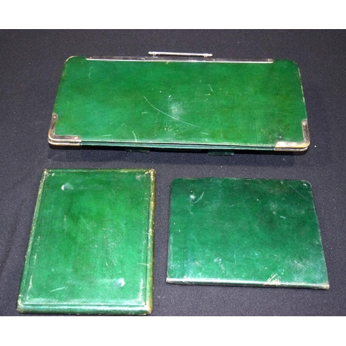 2573 - A vintage grooming set in green leather with folding mirror 37 x 18cm (3).