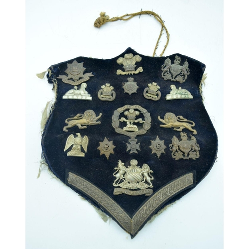 2575 - A collection of military badges and photographs .Qty.