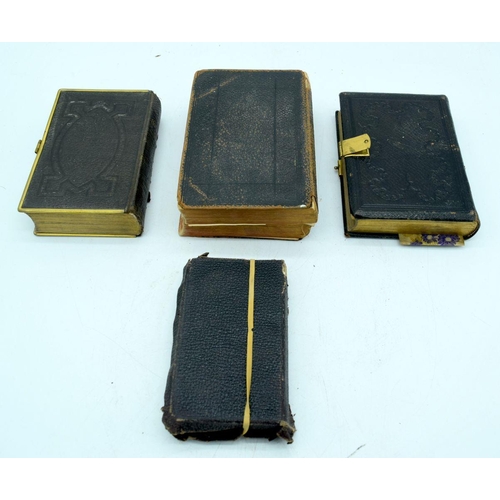 2585 - Three leather bound Bibles largest 18 cm (3).