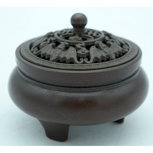 2598 - A small Chinese bronze lidded censer 9 x 7 cm.