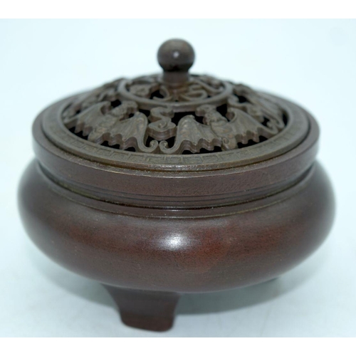 2598 - A small Chinese bronze lidded censer 9 x 7 cm.