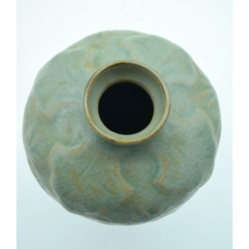 2603 - A Chinese Celadon Mei ping  vase  decorated with foliage in relief . 21cm.