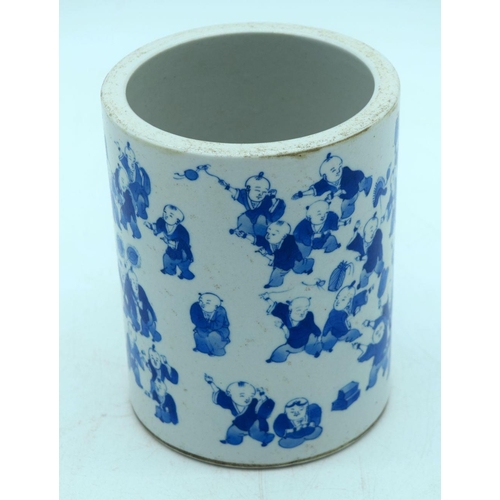 2605 - A Chinese Blue and white brush pot decorated with 100 children pattern. 15 x 12cm.