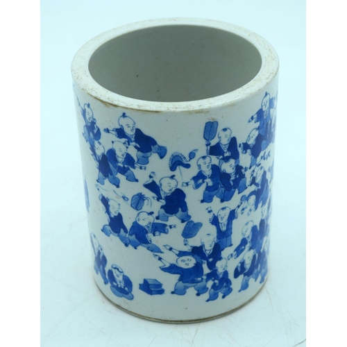 2605 - A Chinese Blue and white brush pot decorated with 100 children pattern. 15 x 12cm.