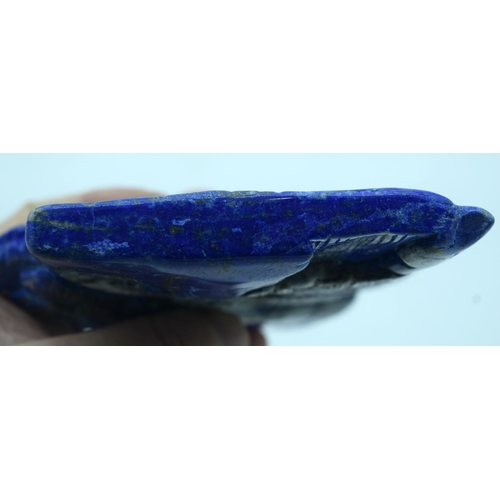 2610 - A carved Lapis Lazuli boulder mounted on a stand 17 x 13cm.