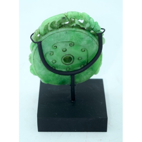 2613 - A Chinese carved Jade boulder on a stand 9 x 8cm.