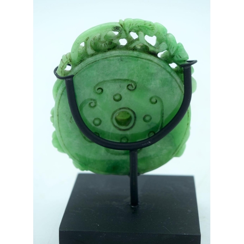 2613 - A Chinese carved Jade boulder on a stand 9 x 8cm.