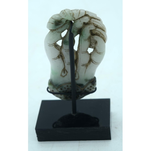 2617 - A Chinese  carved Jadeite boulder on a stand 9.5 cm.