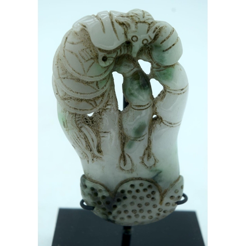 2617 - A Chinese  carved Jadeite boulder on a stand 9.5 cm.