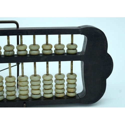 2618 - A Chinese hard wood framed Abacus with Jade counters. 42cm.