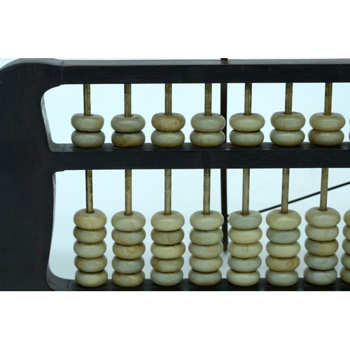 2618 - A Chinese hard wood framed Abacus with Jade counters. 42cm.