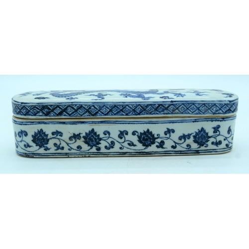 2619 - Chinese blue and white lidded porcelain box decorated with a dragon 32.5 x 8 cm .