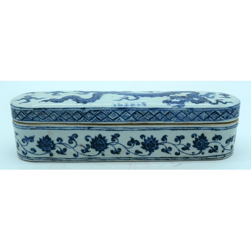 2619 - Chinese blue and white lidded porcelain box decorated with a dragon 32.5 x 8 cm .