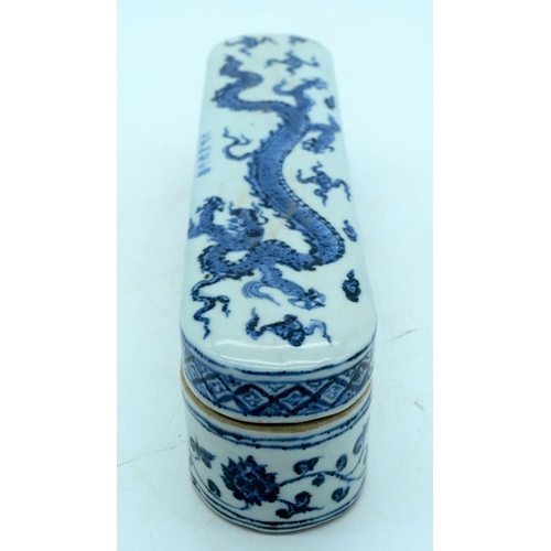 2619 - Chinese blue and white lidded porcelain box decorated with a dragon 32.5 x 8 cm .