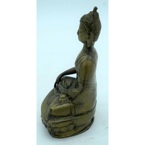 2620 - A Chinese/Tibetan bronze Buddha. 20 x 13 cm.