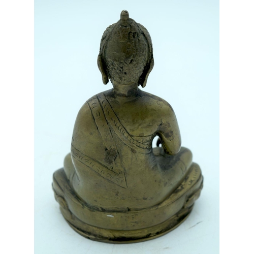 2620 - A Chinese/Tibetan bronze Buddha. 20 x 13 cm.