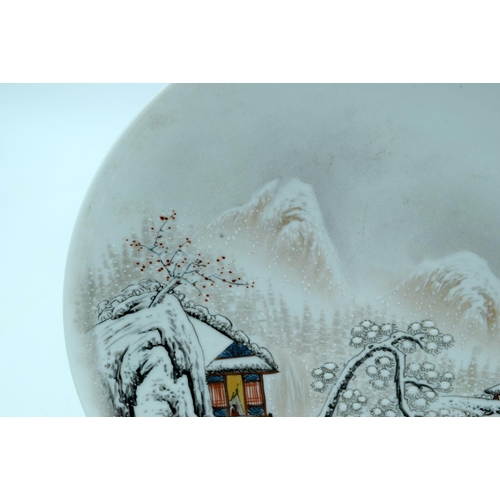 2624 - A Chinese plate celebrating 1973 decorated with a snowy landscape 23cm.