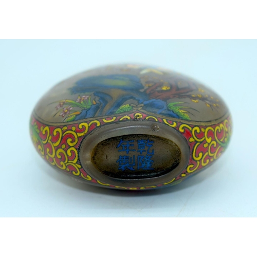 2630 - A Chinese glass snuff bottle decorated with birds and foliage . 8cm.