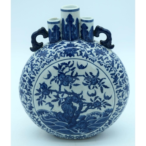 2638 - A Chinese blue and white Moon flask decorated with foliage 27 x 21cm.