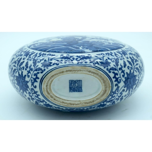 2638 - A Chinese blue and white Moon flask decorated with foliage 27 x 21cm.