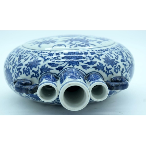 2638 - A Chinese blue and white Moon flask decorated with foliage 27 x 21cm.