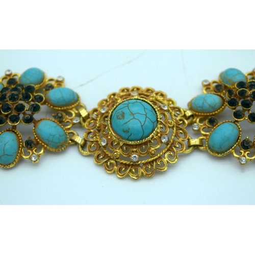 2642 - A Chinese Gilt metal belt with Turquoise stone inserts. 100 cm in length.