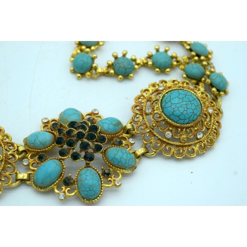 2642 - A Chinese Gilt metal belt with Turquoise stone inserts. 100 cm in length.