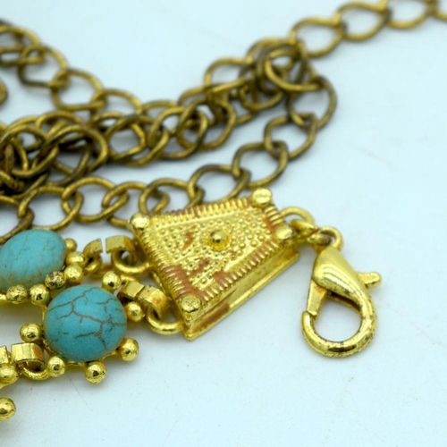 2642 - A Chinese Gilt metal belt with Turquoise stone inserts. 100 cm in length.